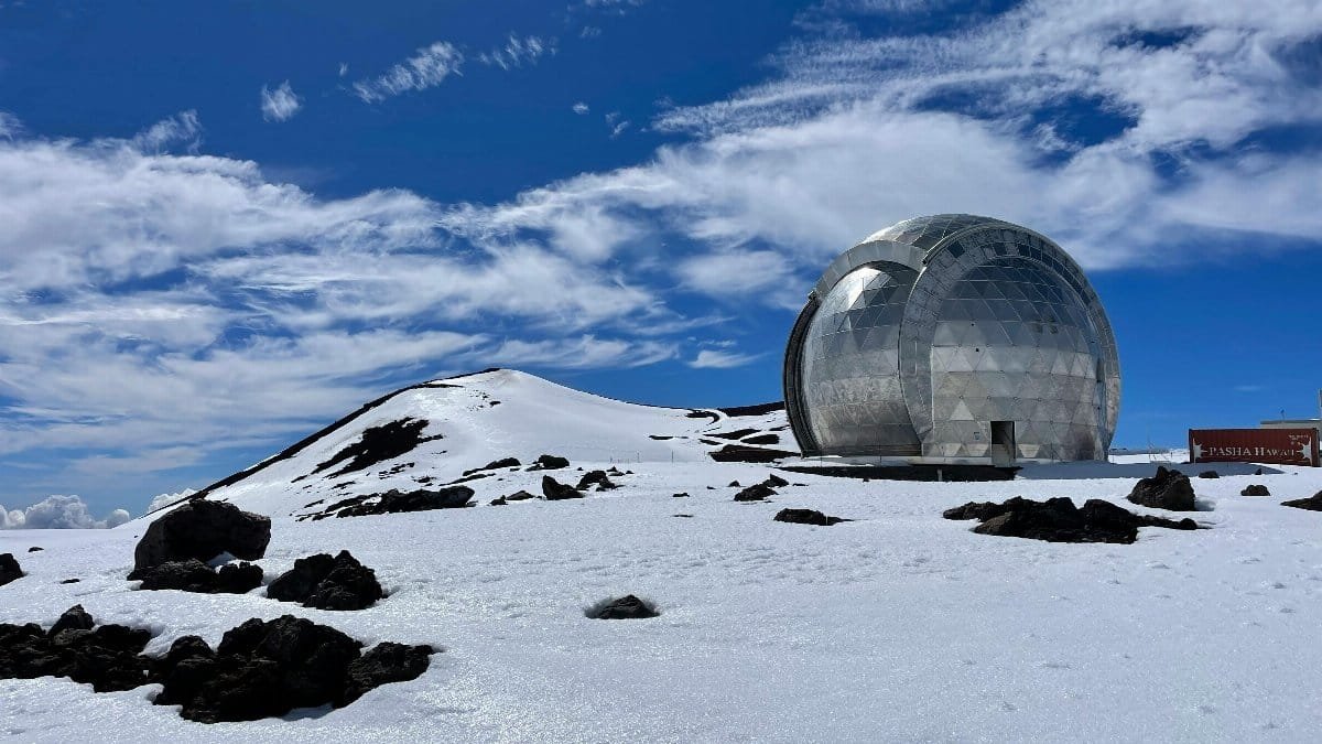 Geodesic observatory on snowy landscape with clear blue sky and clouds in winter. via Pexels