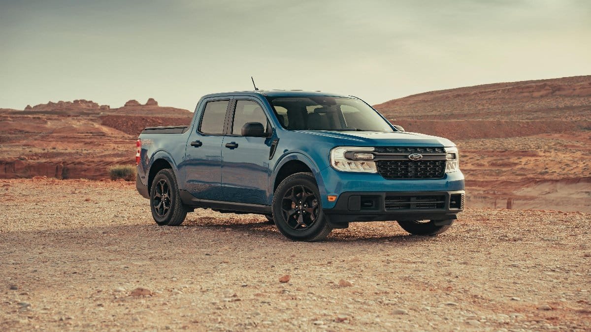 A blue Ford Maverick pickup truck in a serene desert landscape near Page, Arizona. via Pexels