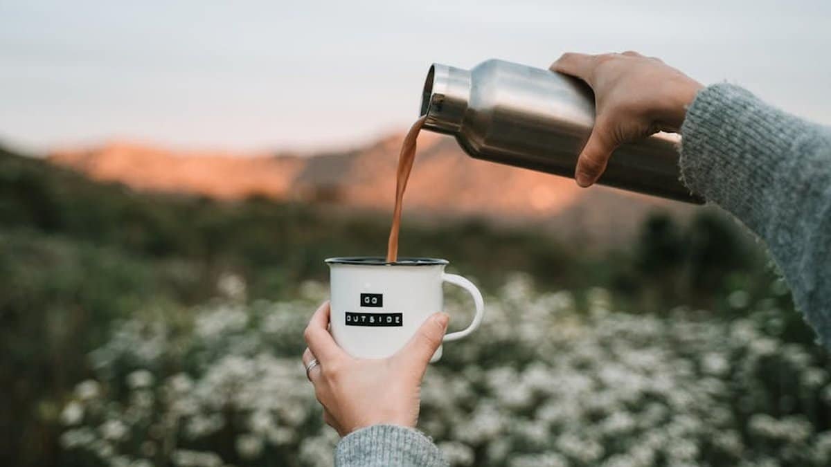 Enjoy a refreshing morning hike with freshly brewed coffee surrounded by nature. via Pexels