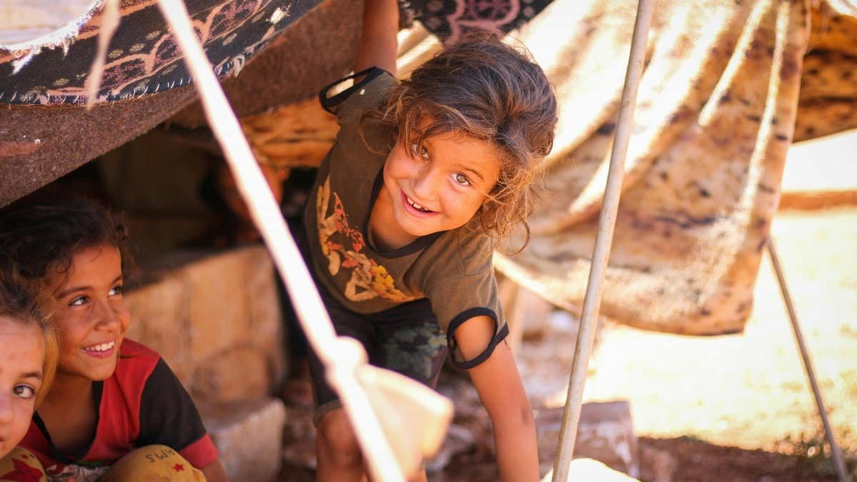 Children enjoying a moment of happiness in a tent settlement in Idlib, Syria. via Pexels