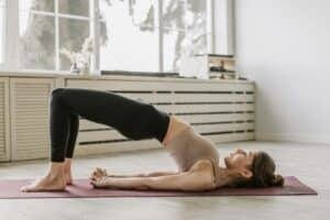 Woman lying on a yoga mat