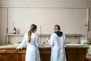 Women in white laboratory gown standing