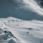 A group of skiers embark on a thrilling ski tour in the snow-covered Alps of Serfaus, Tirol. via Pexels