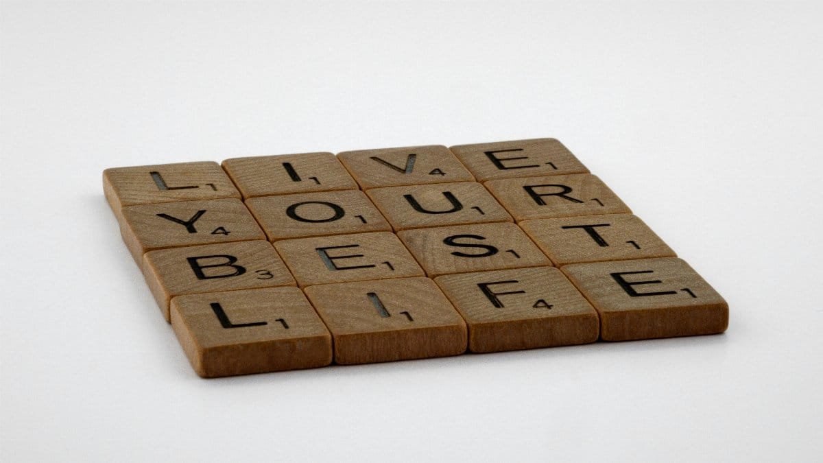 Scrabble tiles spelling 'Live Your Best Life' on a white background. via Pexels