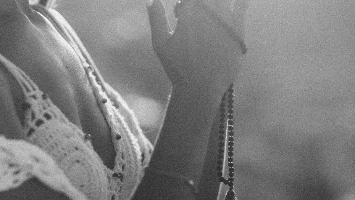Woman practicing meditation outdoors in calm daylight with a boho vibe. via Pexels
