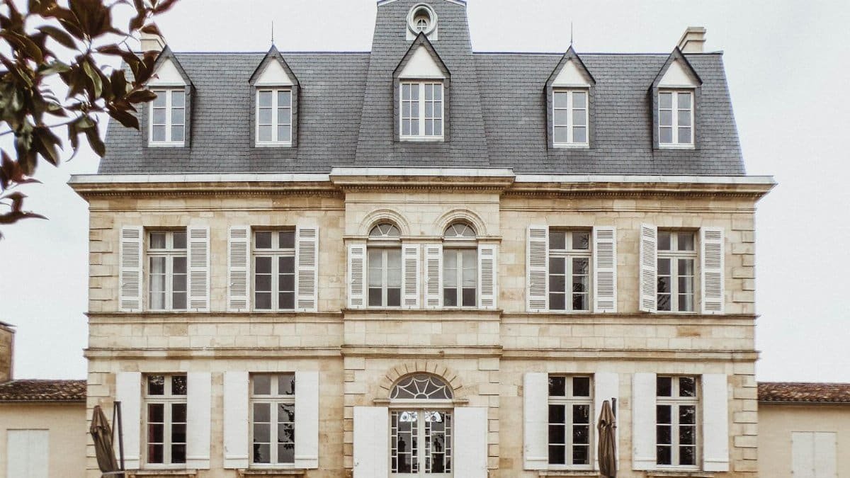 Charming facade of a classic French manor in Bordeaux, showcasing unique architecture.