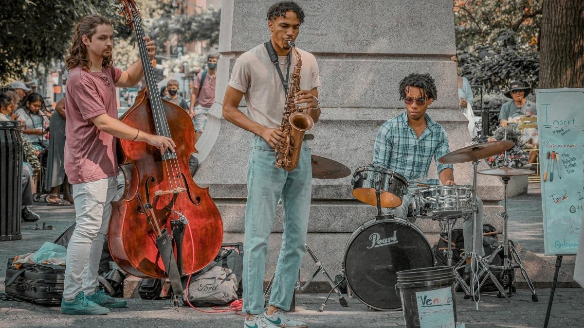 Talented street musicians performing live jazz in a vibrant New York park.