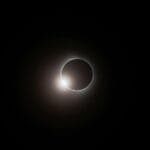 Captivating image of a total solar eclipse with visible corona, creating a mesmerizing celestial scene.