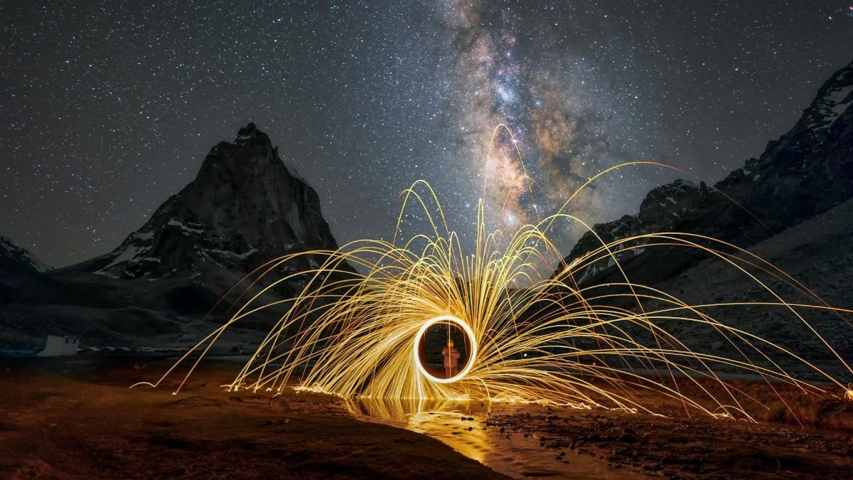 Spectacular long exposure of the Milky Way in Leh with light painting, creating a mesmerizing landscape.