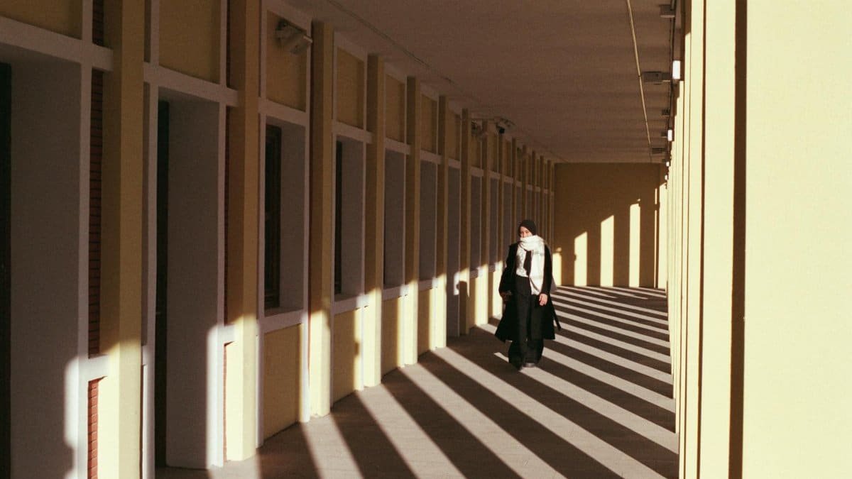 woman walking in hallway