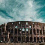 Stunning view of the Colosseum in Rome showcasing its ancient architecture and historic grandeur.