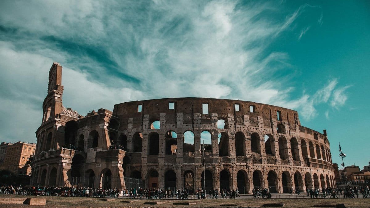 Stunning view of the Colosseum in Rome showcasing its ancient architecture and historic grandeur.