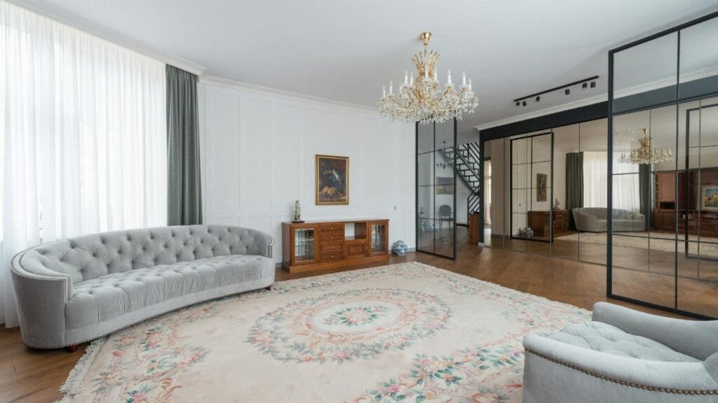 A modern and spacious living room featuring elegant decor and luxury furniture.