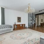 A modern and spacious living room featuring elegant decor and luxury furniture.