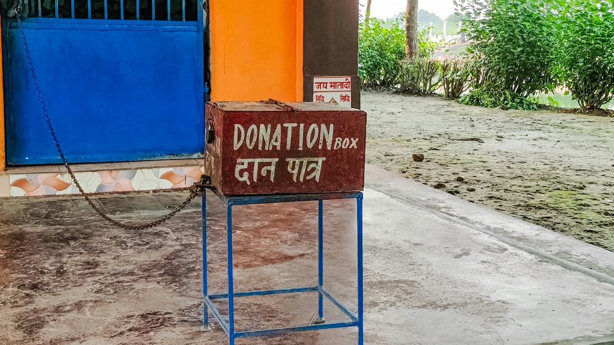 Donation box outside an Indian temple, symbolizing charity and spirituality.