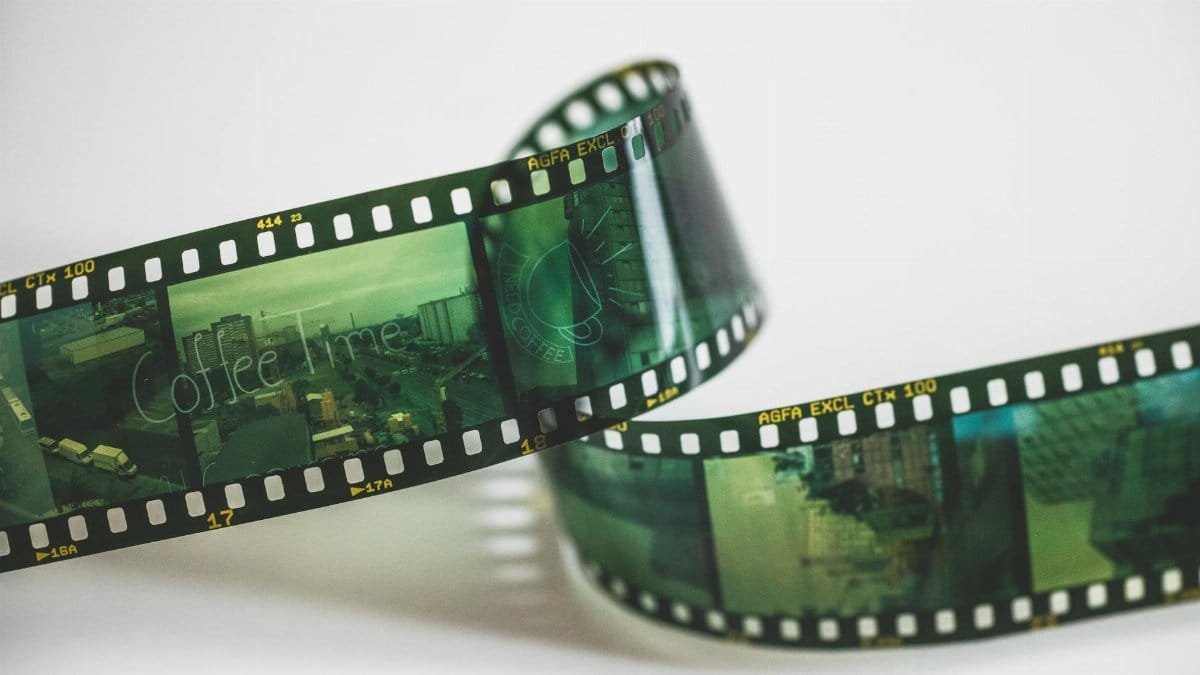Close-up of a vintage AGFA filmstrip with cinematic exposures, evoking nostalgia.