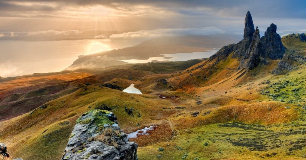 Stunning sunrise at Old Man of Storr in Scotland, highlighting rocky peaks and lush landscapes via Pexels