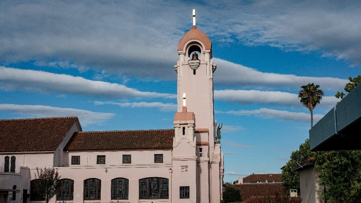 Stunning view of the Mission San Rafael Arcangel against a bright blue sky.