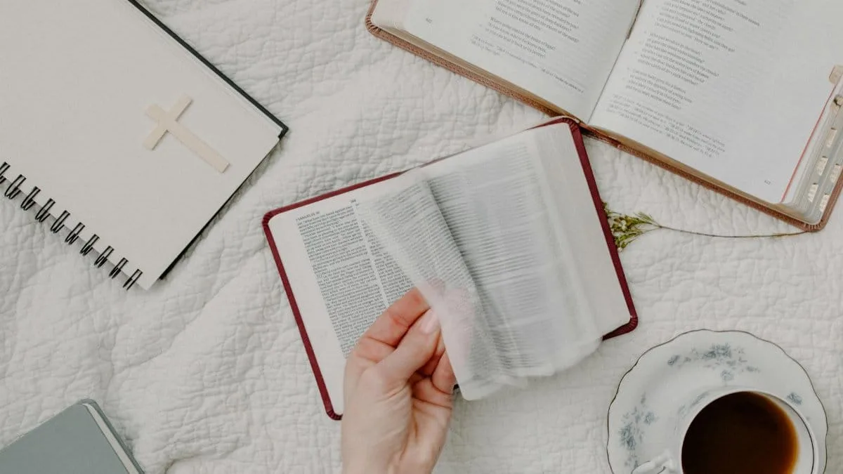 A cozy setup of Bible reading with a cup of coffee, evoking a peaceful morning routine.
