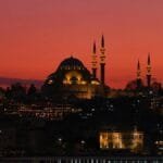 Scenic view of Istanbul cityscape with a mosque and ferry during sunset, capturing urban beauty. via Pexels