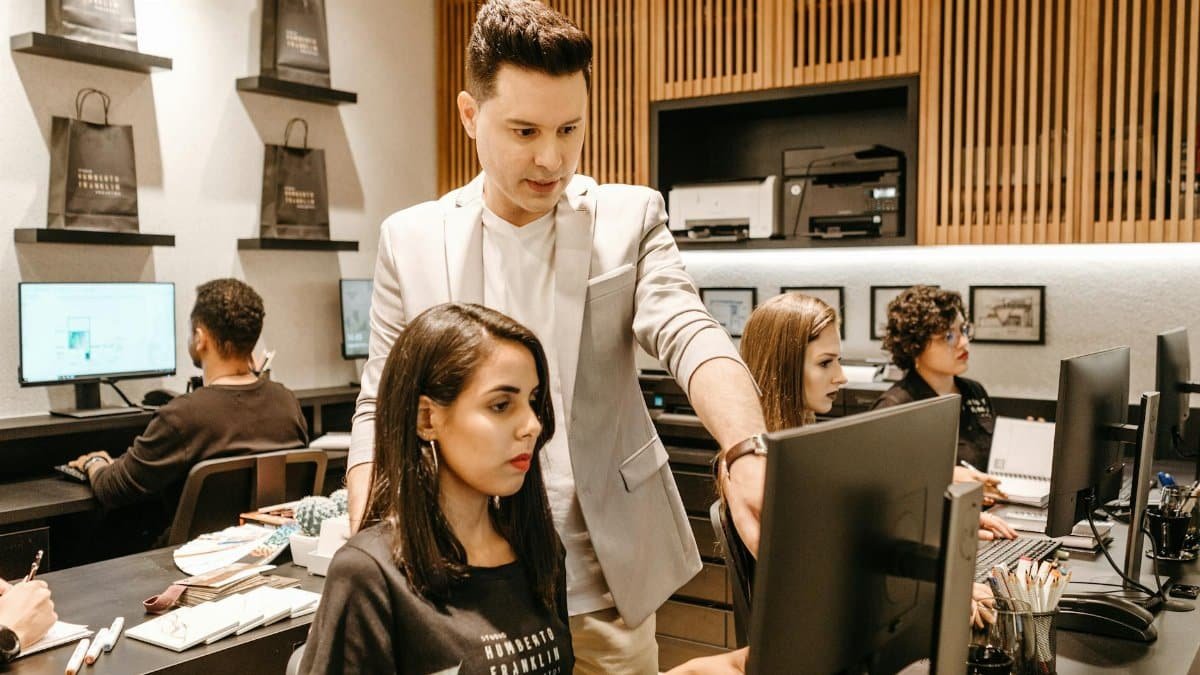 A diverse team collaborates in a modern office environment, fostering innovation and productivity.