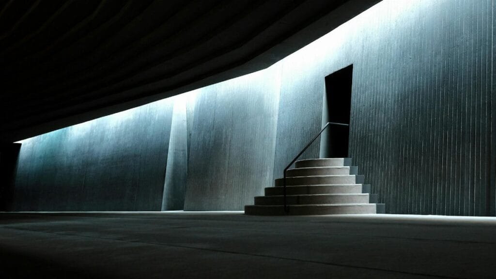 Minimalist view of the Sancaklar Mosque entrance emphasizing modern architecture and lighting.