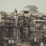 Vintage view of Varanasi's iconic riverfront architecture along the Ganges River, a popular tourist destination in India.