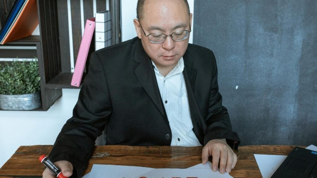 Business professional working with charts and diagrams at a desk.