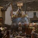 A colorful religious procession in Cusco, Peru, showcasing local culture and tradition.