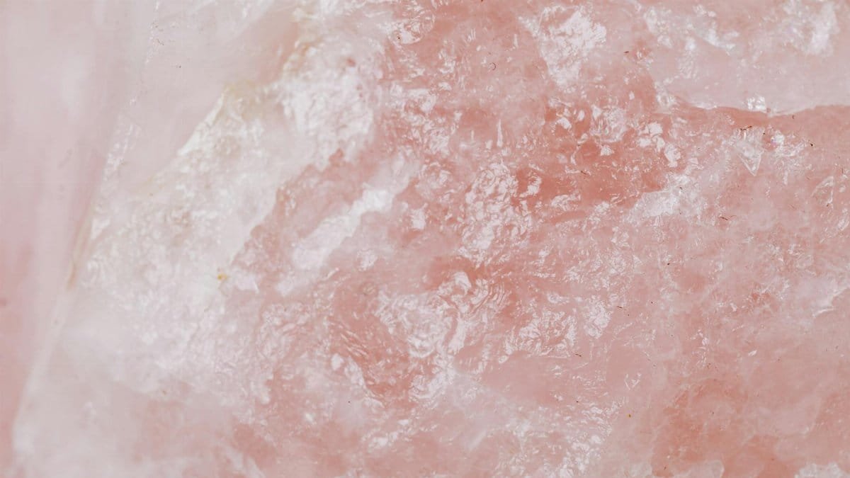 Detailed view of rose quartz showcasing its pink crystalline texture and natural patterns.