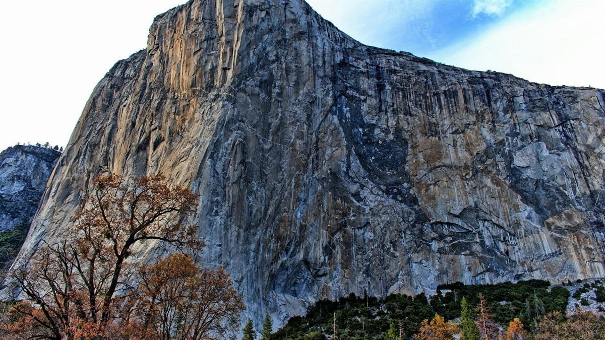 View of El Capitan's granite cliff in Yosemite National Park during fall.