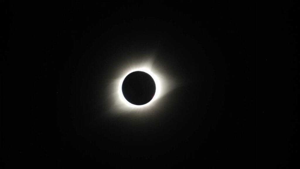 Captivating image of a total solar eclipse showcasing the sun's corona in the dark sky.
