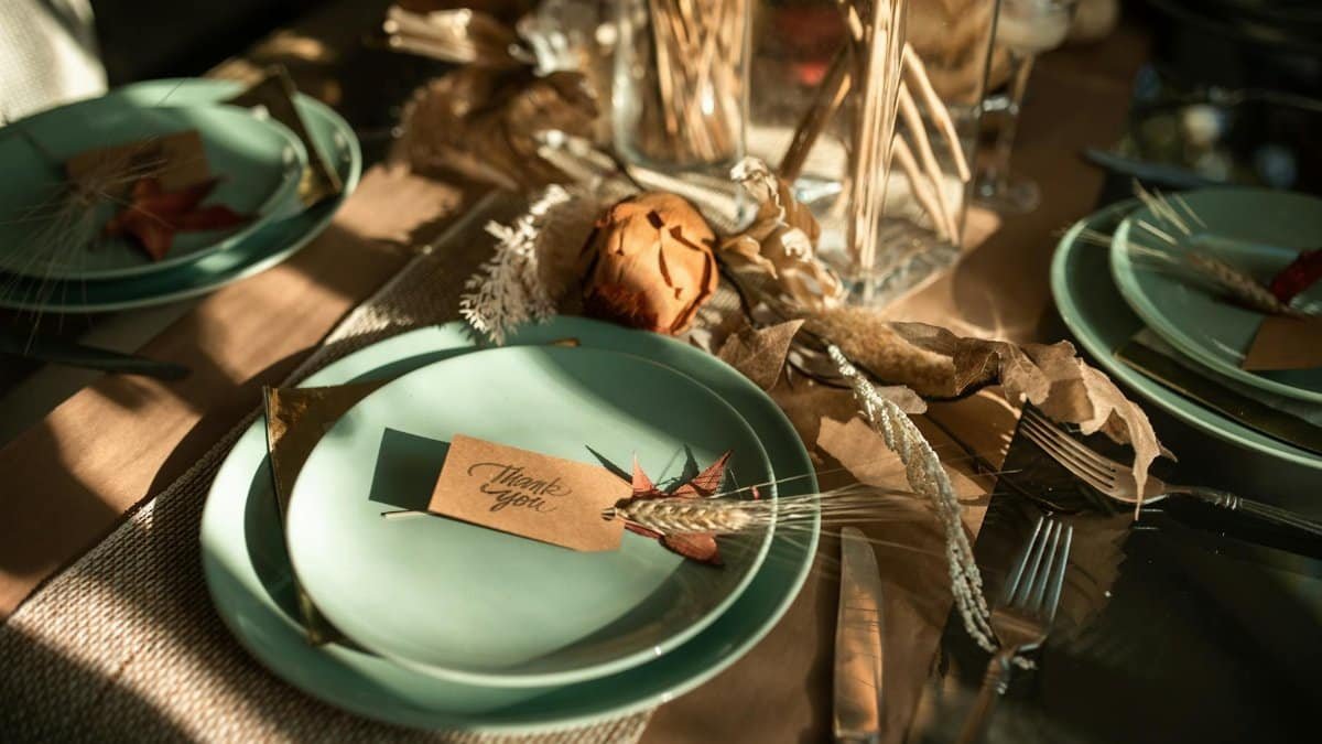 Inviting Thanksgiving table arrangement featuring autumn-themed elements with a warm and elegant touch.