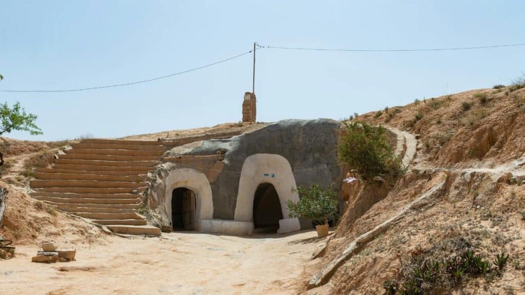 Discover ancient Berber cave homes carved into the desert landscape of Matmata, Tunisia.