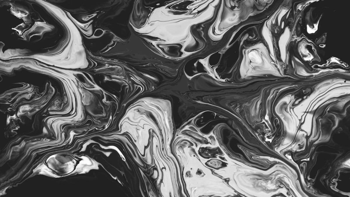Intricate black and white abstract swirl pattern creating mesmerizing and fluid art design.