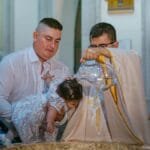 A child's baptism ceremony in a church in Santo Domingo, Ecuador.
