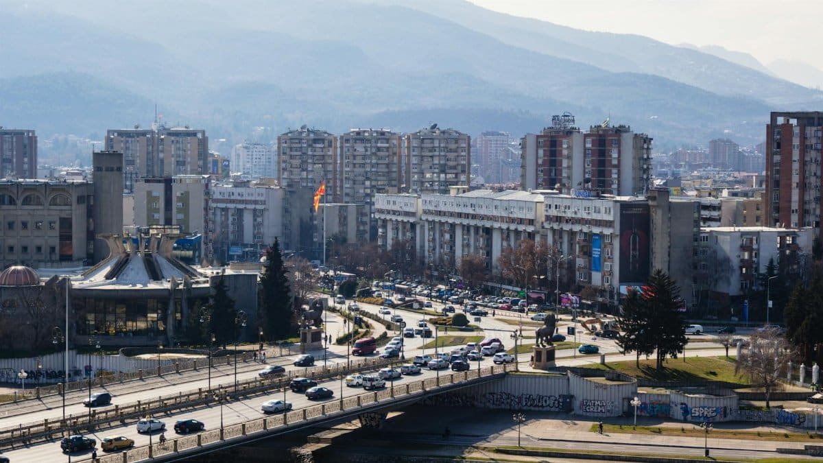 A bustling day in Skopje, North Macedonia, featuring urban architecture and scenic landscape.