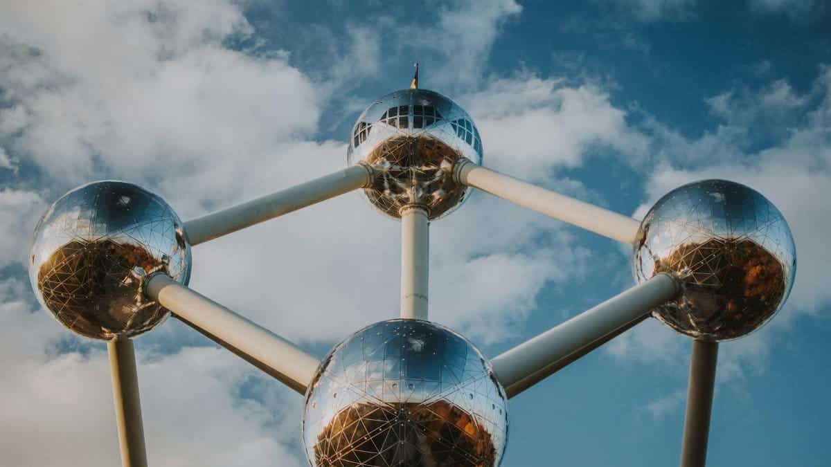 Iconic spherical structure Atomium in Brussels against a blue sky.