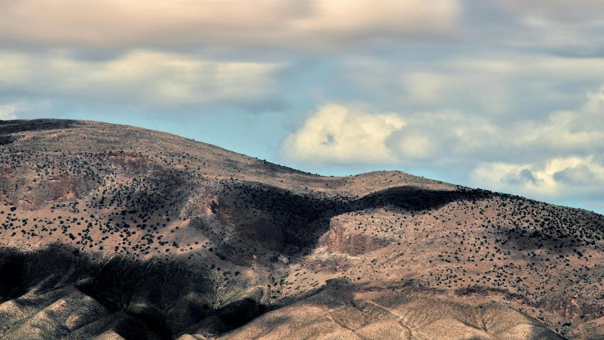 Beautiful view of desert hills under dramatic sky in Guercif, Morocco.