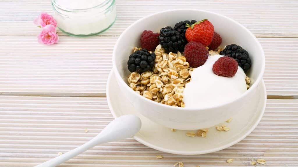 Delicious granola bowl topped with fresh berries and yogurt, perfect for a healthy breakfast.