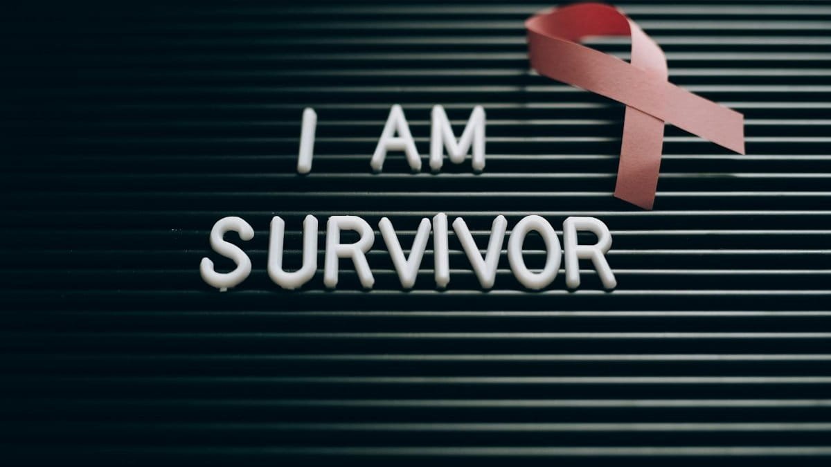 Inspiring message with a pink ribbon symbolizing breast cancer survival and awareness.