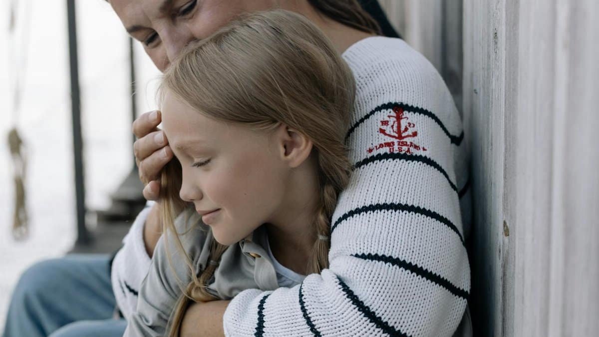 Emotional hug between a loving grandmother and her granddaughter, radiating warmth and connection.