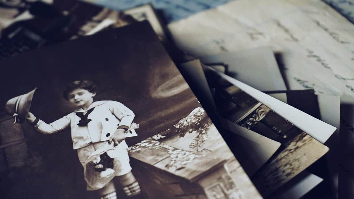 A nostalgic close-up of vintage photos and letters revealing memories from the past.