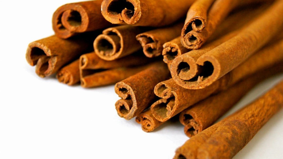 Aromatic cinnamon sticks displayed in a close-up view, capturing the texture and rich brown color.