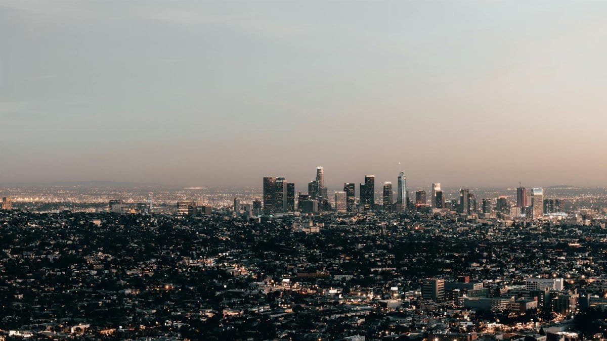 Captivating aerial view of Los Angeles skyline with a tranquil dusk ambiance.