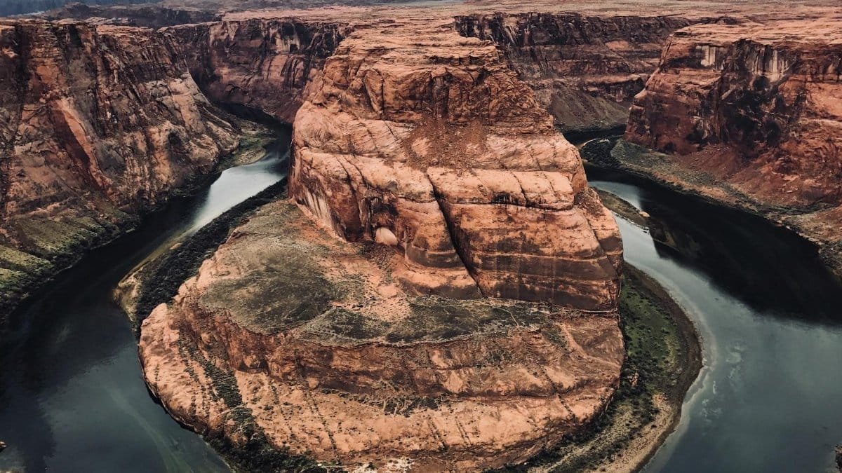 Breathtaking view of Horseshoe Bend in Page, Arizona with the Colorado River winding through the canyon.