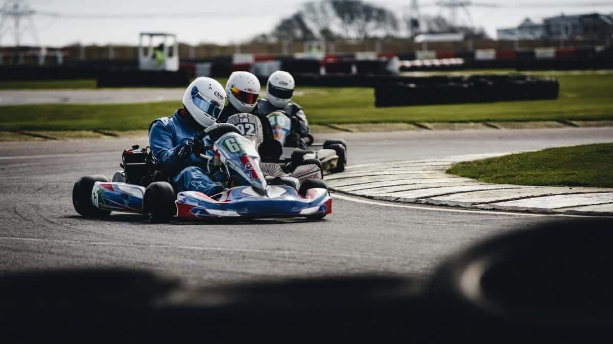 Competitive go-kart race on an outdoor track, showcasing speed and skill.