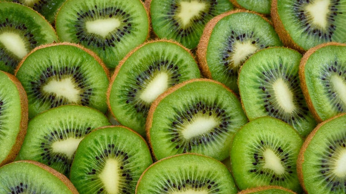 Vibrant, fresh kiwi slices arranged close-up, highlighting their juicy and nutritious appeal.