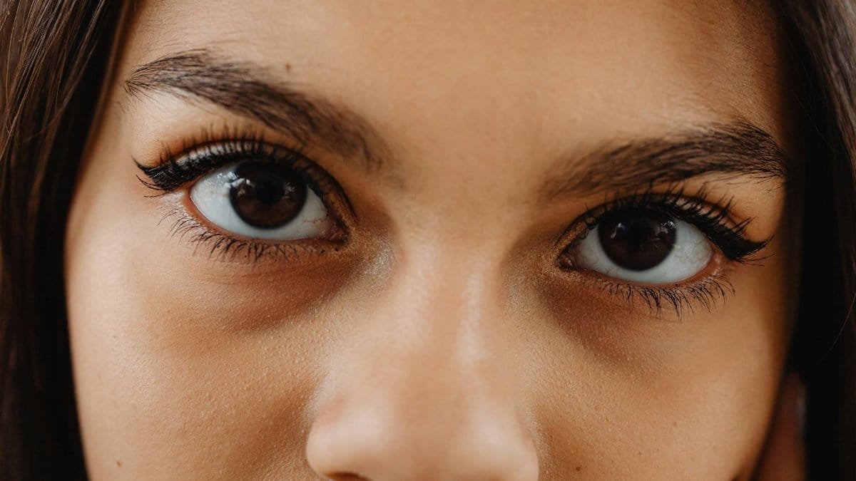 Intimate close-up shot focusing on woman's eyes, capturing detail and expression.
