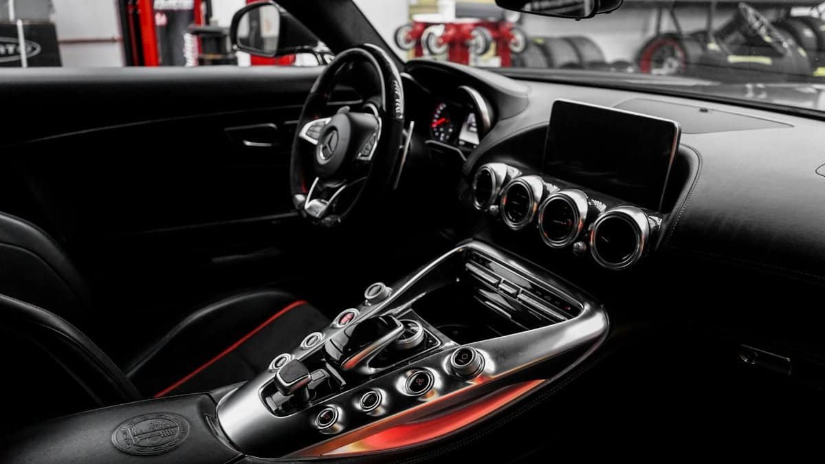 Modern luxury car interior showcasing a high-tech dashboard and sleek design features.
